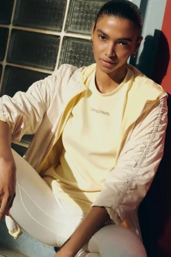 Dash and Stars Chaqueta ligera reversible capucha amarillo estampado New